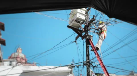 Man on ladder working on the power lines Stock Footage 34653602