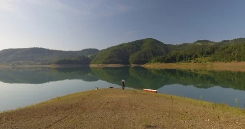 Man on lake Stock Footage 115361791