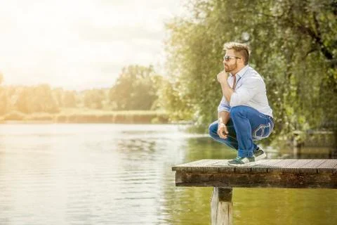 Man at the lake Stock Photos