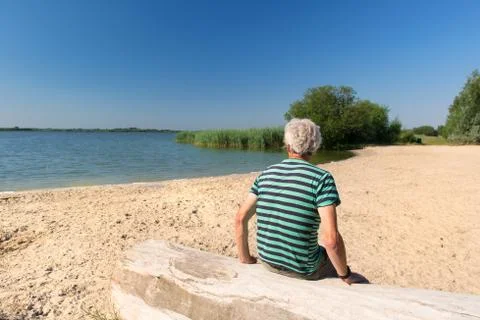 Man in landscape with river Foto stock