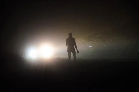 Man with a lantern at night Stock Photos