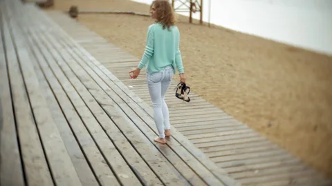 A man with laptop and documents on the background of a stonewall wall Works and Stock Footage 93190205