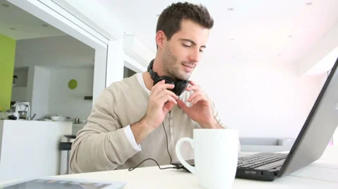 Man with a laptop and headset on Stock-Footage 38127083
