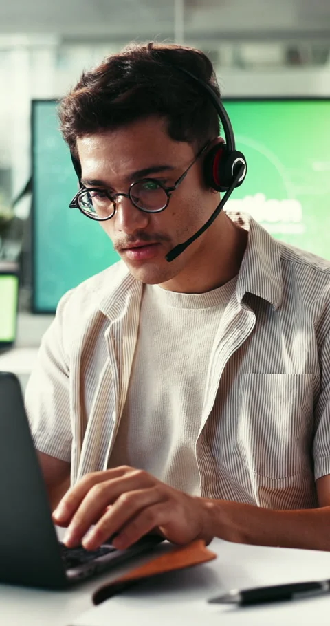 Man, laptop and headset with talk for climate consulting, typing report or Stock Footage 333608005