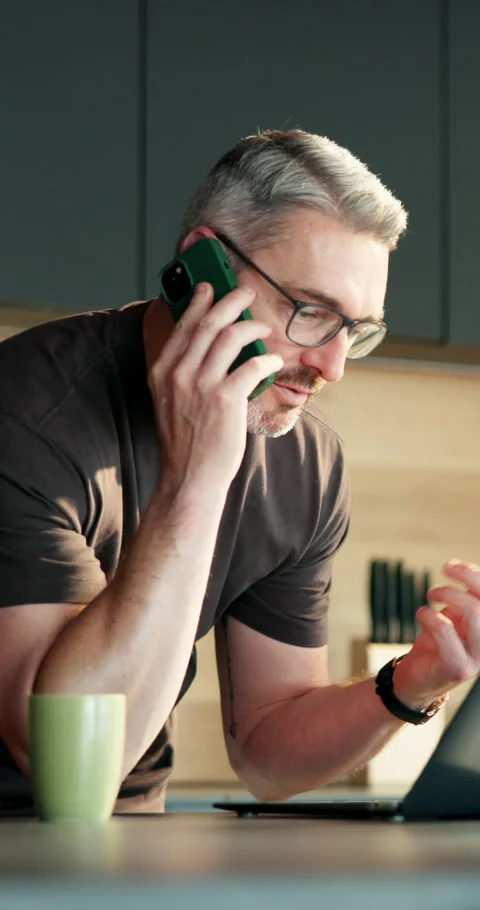 Man, laptop and remote work in house with phone call, glasses and conversation Stock Footage 337155942