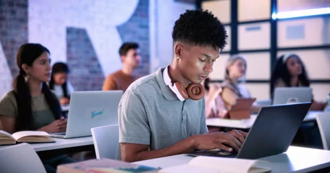 Man, laptop and typing in classroom at college for notes, review and development Stock Footage 336302168