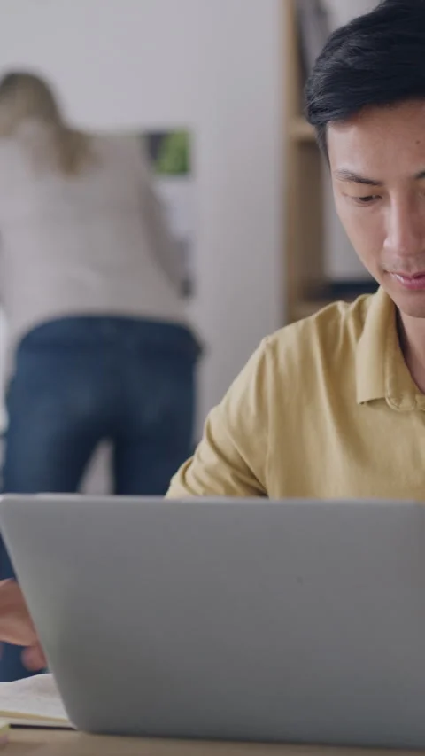 Man, laptop and writing for document, vendor comparison or review in creative Stock Footage 335109316