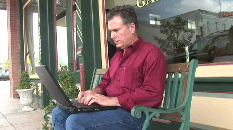 Man laptop bench 1 Stock Footage