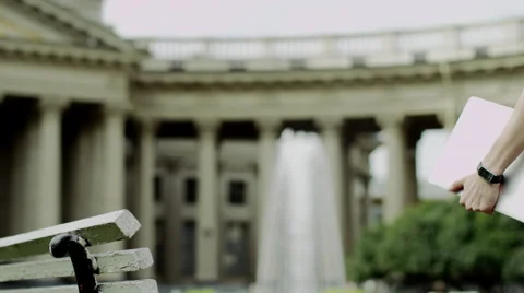 Man with laptop on a bench Stock Footage 68802301