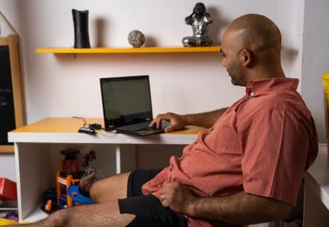Man with laptop in comfortable clothes Stock Photos