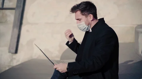 A man with a laptop communicates for work Stock Footage 126730859