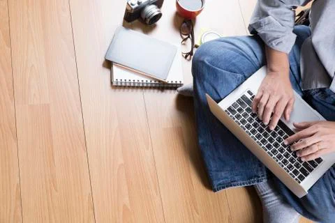 Man with laptop computer, coffee cup and tablet - top view Stock Photos