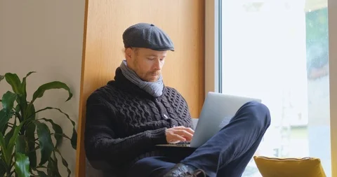 Man with laptop indoors Stock Footage 122339810