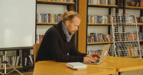 Man with laptop indoors Stock Footage 122339854