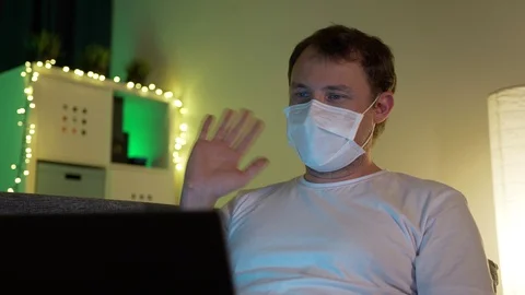 Man with laptop talking on video Stock Footage 129117580