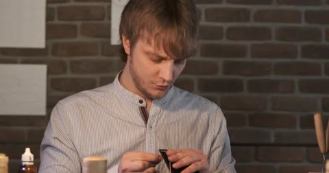 Man with Large Needle Sews two Pieces of Processed Genuine Leather. Accessory Stock Footage 148251447