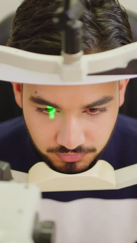 Man, laser machine or eye scan with vision test for sight or healthcare in Stock Footage 327285659