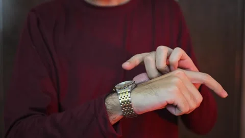 The man is late and points at his watch. No time to wait Stock Footage 337847585