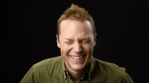 Man laughing with black background Stock Footage 42237748