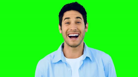 Man laughing at the camera on green scre... | Stock Video | Pond5