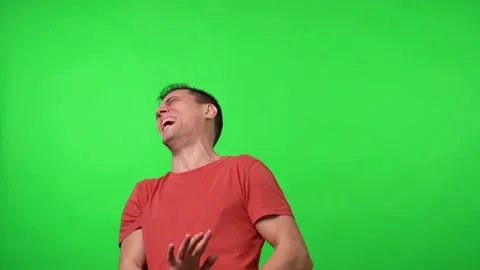Man laughing out loud. Medium shot. Chroma green background. 스톡 동영상 148976452