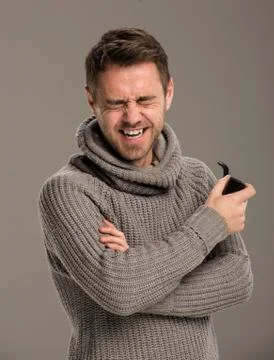 A man laughing with a pipe. Stock Photos