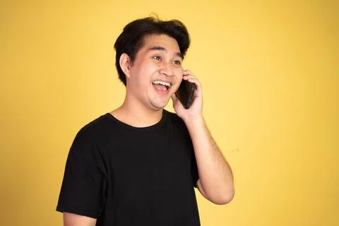 Man laughing while making phone call on isolated background Stock Photos