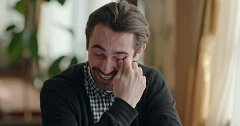 Man laughing while remembering funny memories Stock Footage 93398269