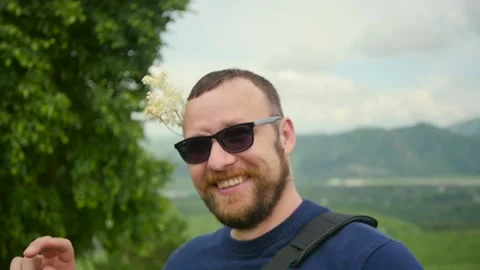 A man laughs and dances against the backdrop of beautiful nature. Slow motion Stock Footage 156294993