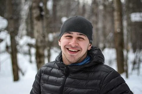 The man laughs in the winter in the forest Stock Photos