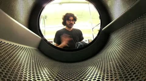 Man at laundry mat - HD Video stock 12653996