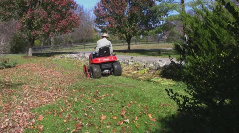 Man on lawnmower 1 Stock Footage 33313862