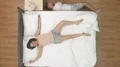 The man lay near the bed. view from above 4k or 4k+ Resolution