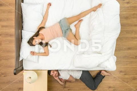 The man lay near the bed. View from above Stock Photos