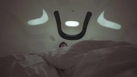 A man is laying in bed with a blanket over his head Stock Footage 314901449