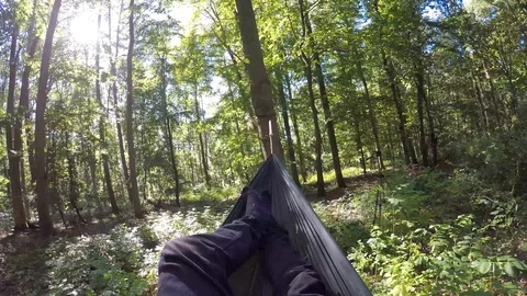Man Laying in Hammock in Forest - Relaxing in Nature Stock Footage
