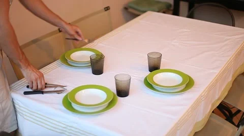 Man laying serve dishes on the table Video stock 11235636