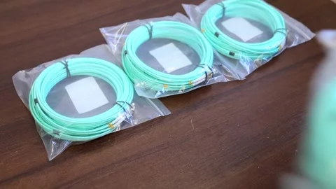 A man lays out a patch cord on the table Video stock 282983768