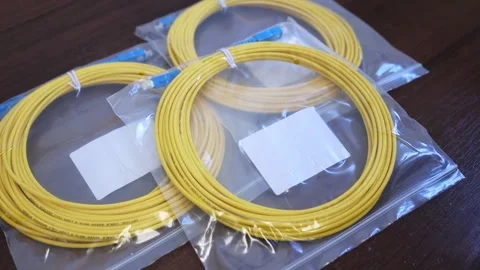 A man lays out a patch cord on the table Stock Footage 282983794