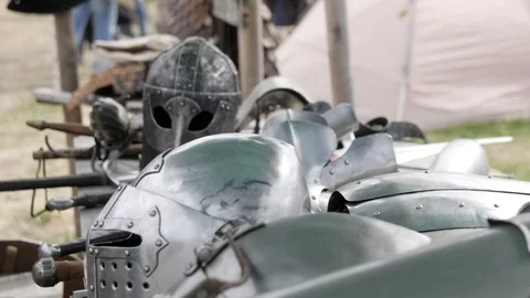 Man to lays a rapier on the table with armor and weapons Stock-Footage 103914076