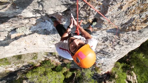 Man lead climbing in wall next to sea 4K 6 Stock Footage 139982309