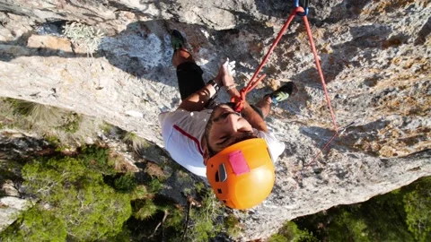 Man lead climbing in wall next to sea 4K 12 Stock Footage 139982467