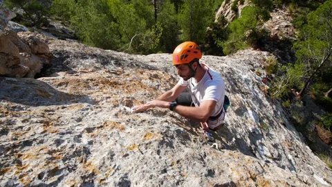 Man lead climbing in wall next to sea 4K 16 Stock Footage 139982532