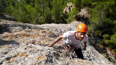 Man lead climbing in wall next to sea 4K 13 Stock Footage 139982533