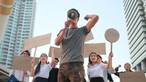 Man lead group or crowd of Asian protestors to demand or suppliant request Stock Footage 143511988