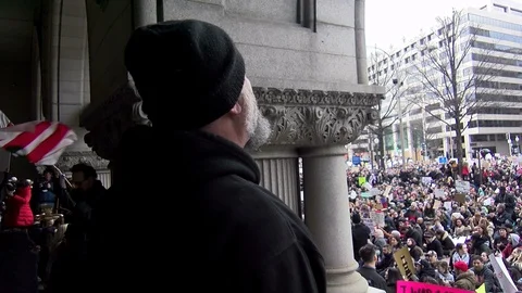 A man leads a crowd in a chant "This is what democracy looks like" at a prote Video stock 125867732
