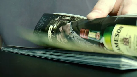 Man leafing through a magazine Stock Footage 79848256