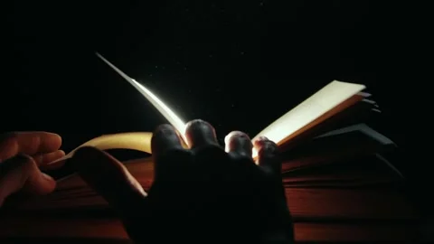 A man leafing through an old book 库存影片 258835640