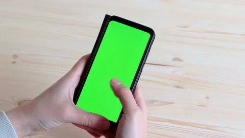 Man leafs through smartphone screen with green screen swipe. Stock Footage 153858164