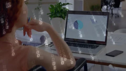 Man leaning back viewing pie chart on laptop at tech workspace, binary code Stock Footage 308658500